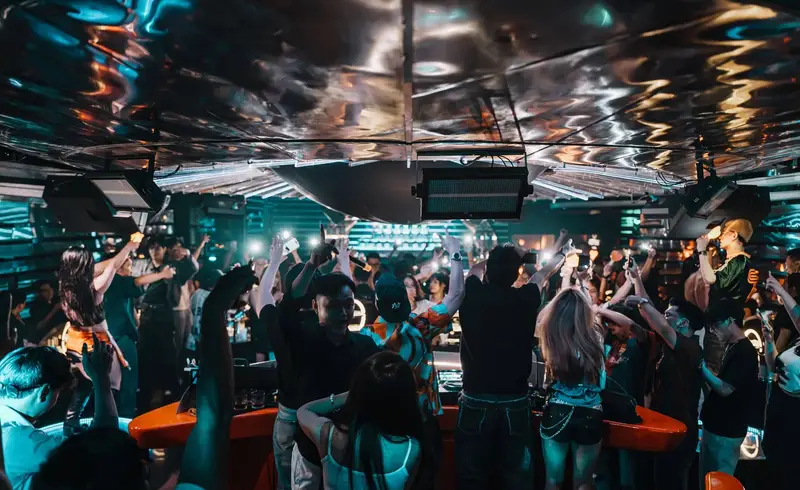 Central DJ booth under the mirrored ceiling